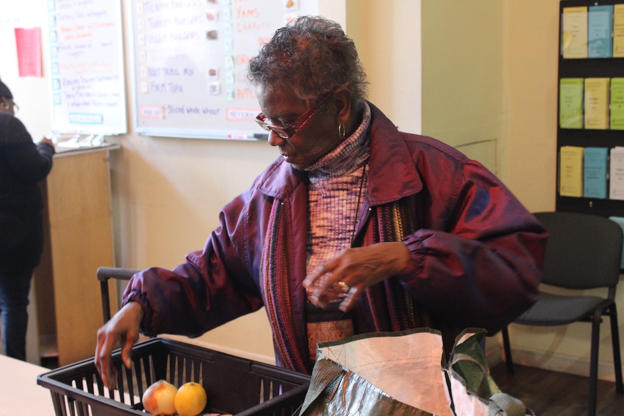 Avis Cole picking up her healthy groceries at Project Open Hand's East Bay location