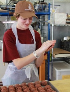 Project Open Hand Purchasing Manager Vanessa Rodgers lends a hand with meatball making.