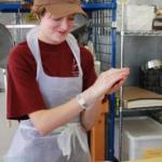 Project Open Hand Purchasing Manager Vanessa Rodgers lends a hand with meatball making.